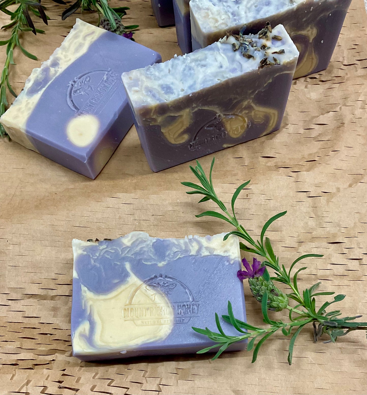 Artisan lavender soap infused with raw honey, nestled among dried blooms