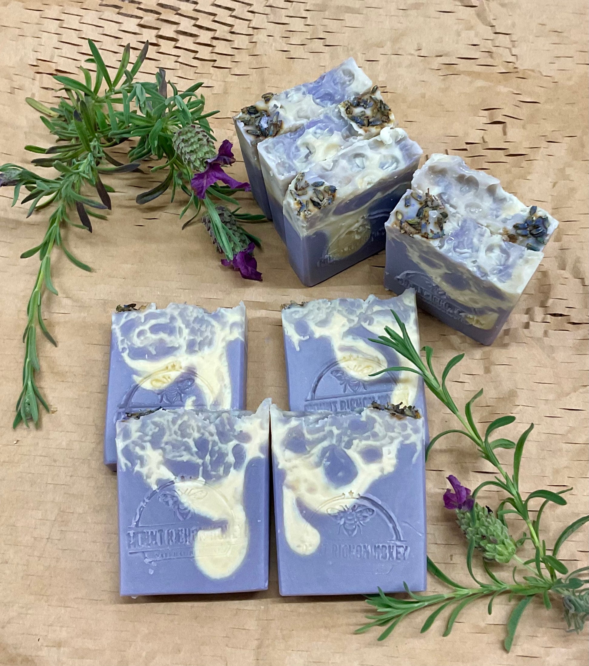 Cold process lavender soap bars with honey, styled on wood with floral accents
